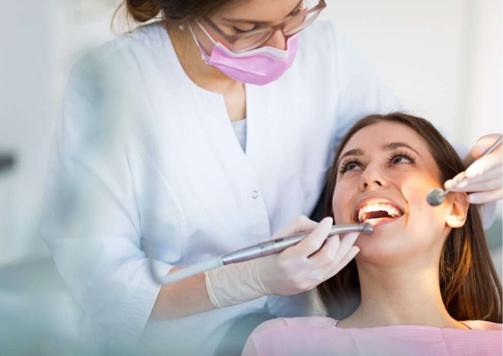 Patient receiving root canal treatment while a dentist explains recovery expectations, including whether it is safe to drive after a root canal procedure.