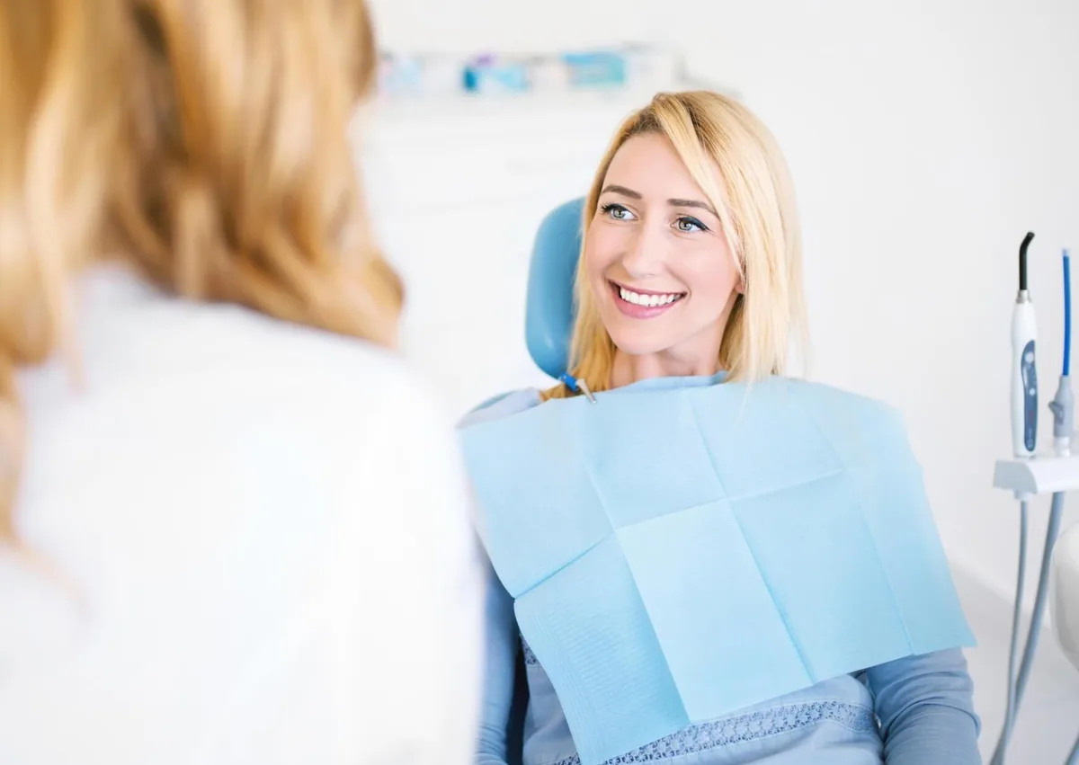 Patient discussing fluoride treatment and preventive dental care with a dental professional.
